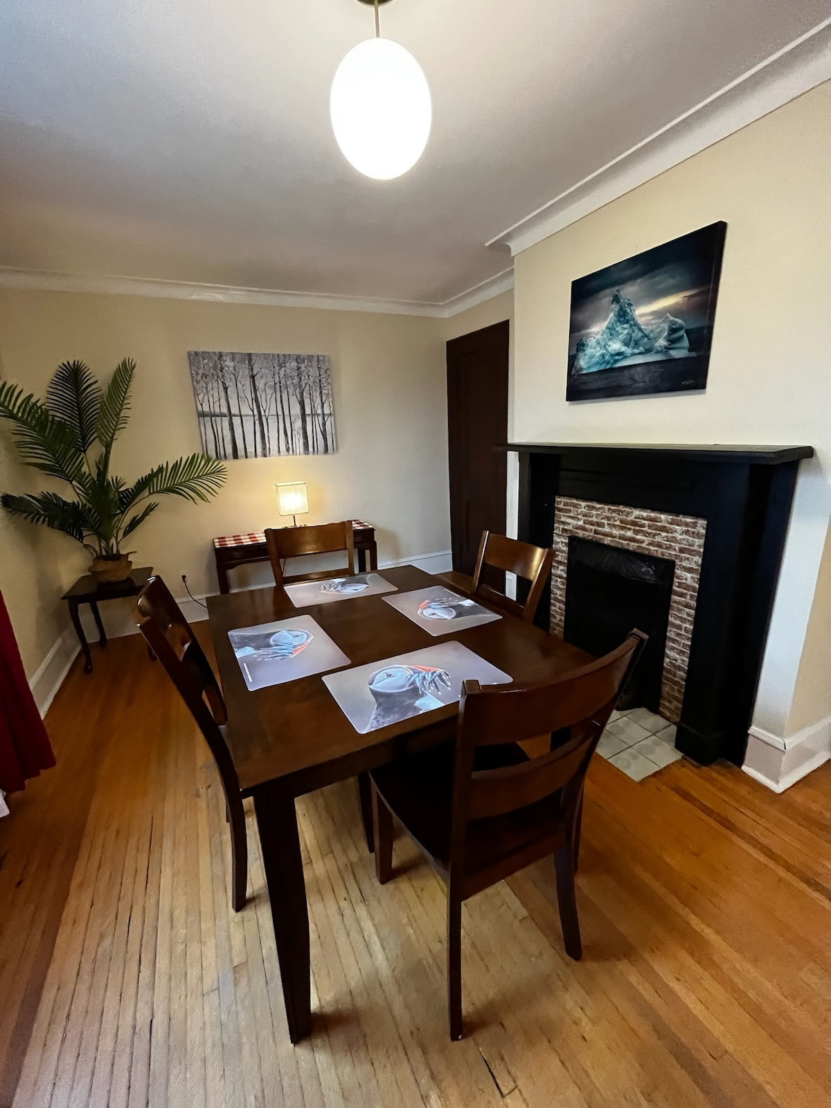 The Hill Flat dining area with fireplace