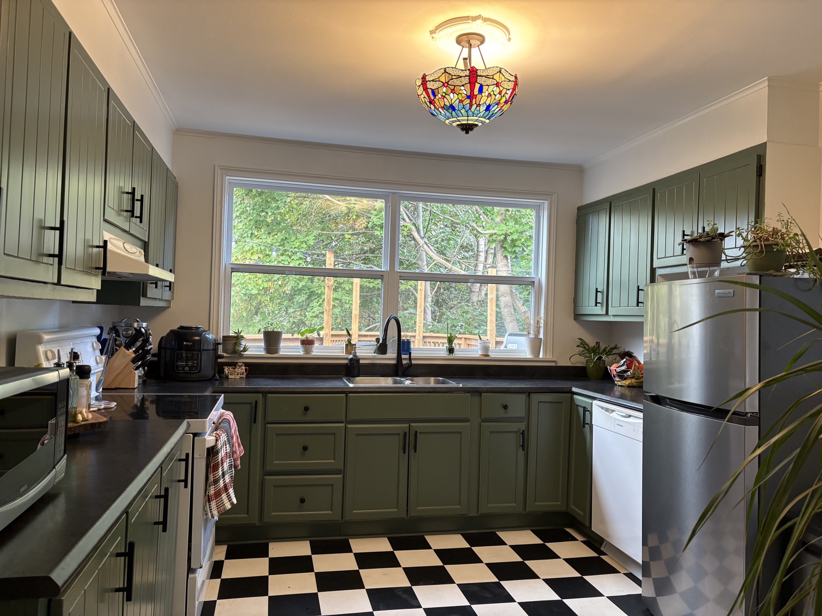 The LaCour House green bedroom with mirror